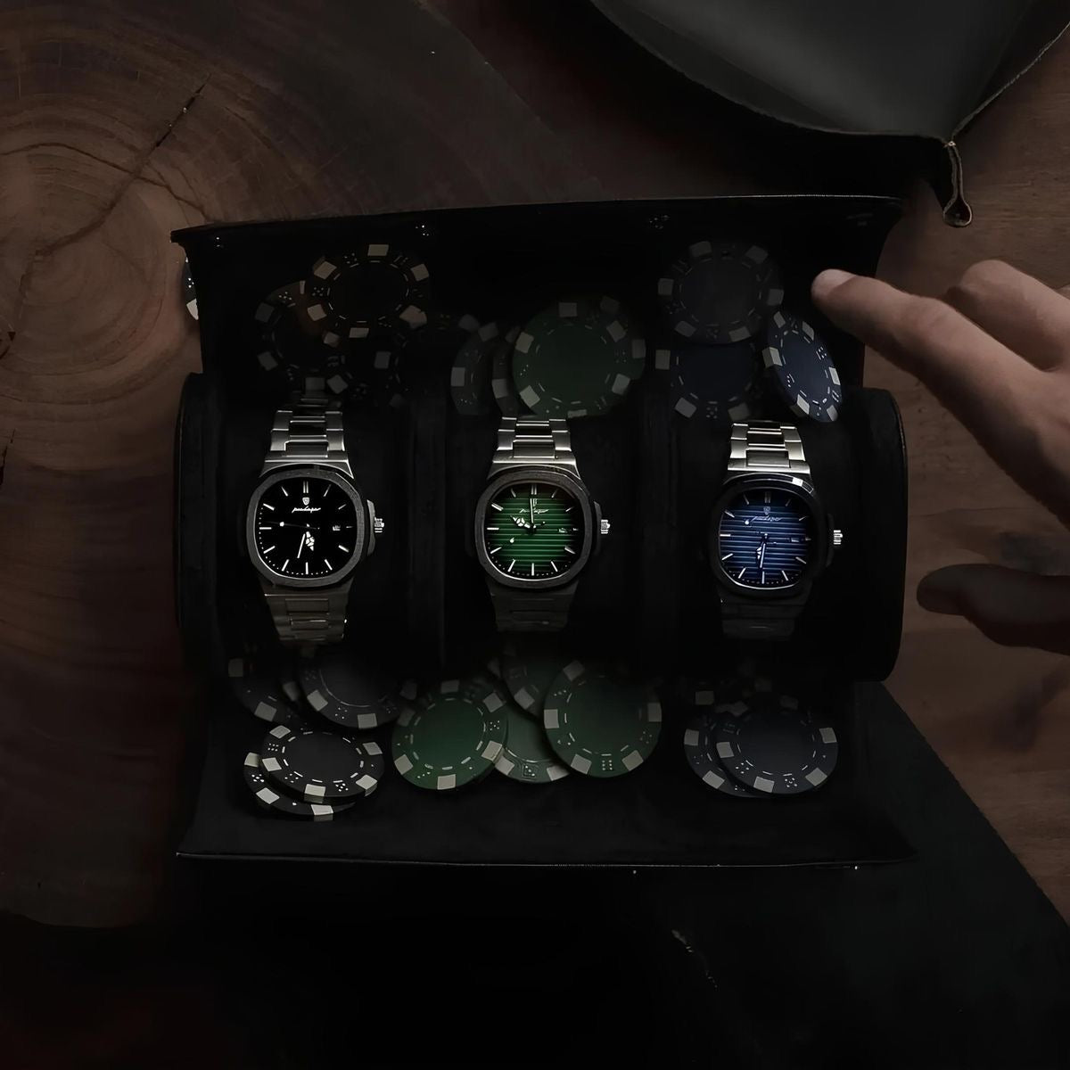 Three watches with digital displays on a wooden surface
