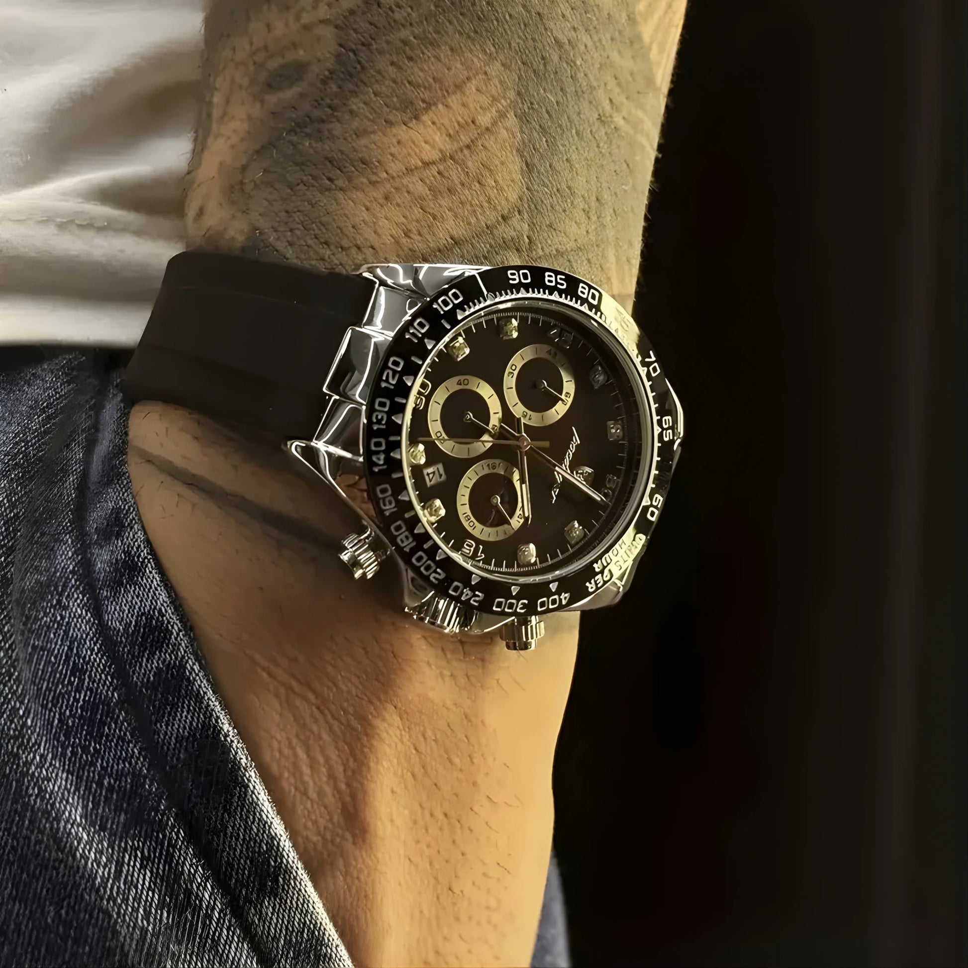 Luxury watch on a person's wrist with a dark background