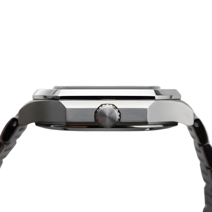 Poedagar Dumont square stainless steel men’s watch with blue textured dial, day-date display and integrated bracelet. Close-up of a silver watch