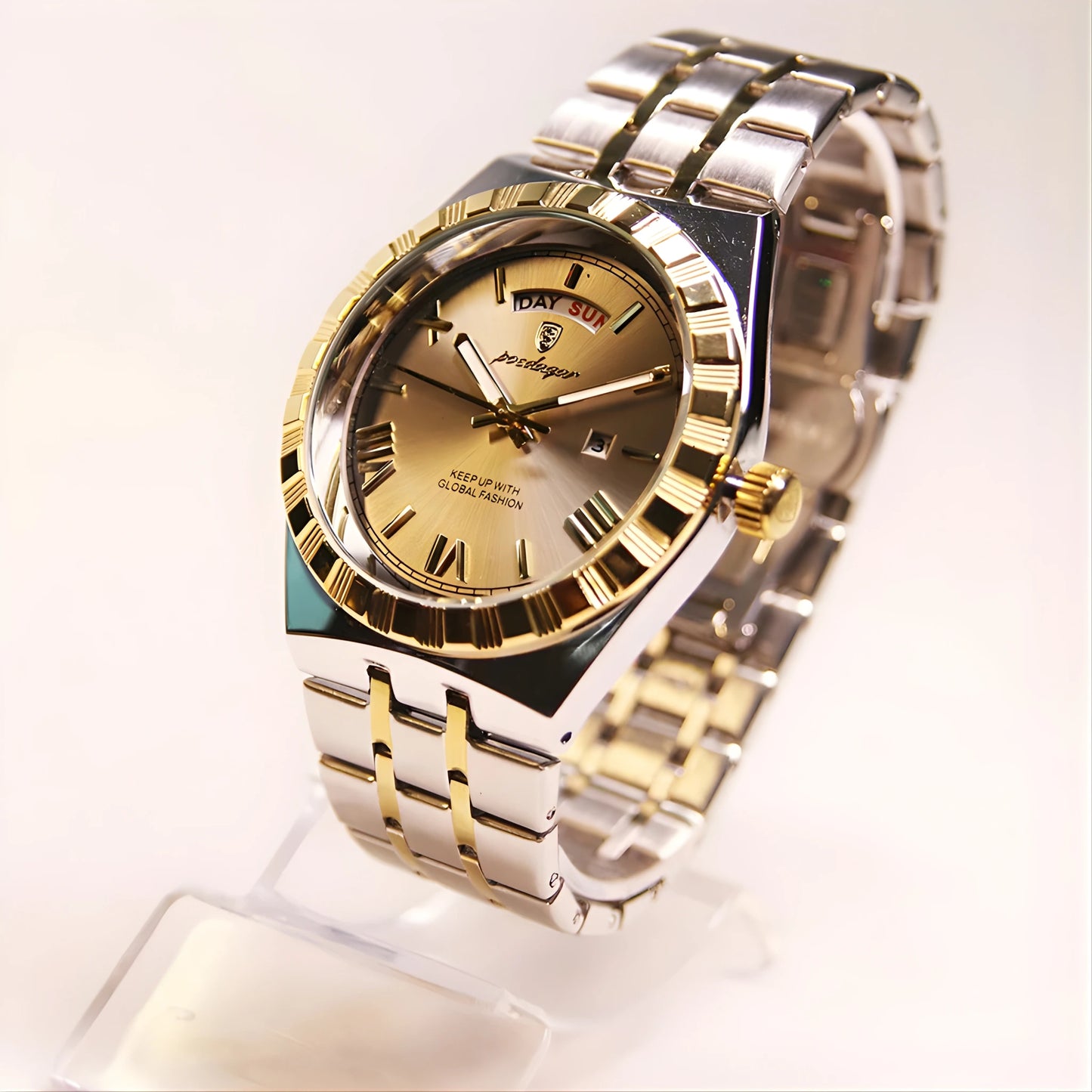 Luxury watch with gold and silver band on a white background