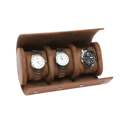 Brown leather watch display case with three watches on a white background